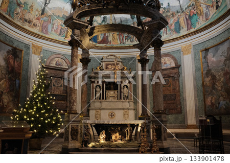 Basilica of the Holy Cross in Jerusalem Rome apse with mosaic baldachin and nativity scene Christmas decorations ornate Catholic church interior editorial use only. High quality photo 133901478