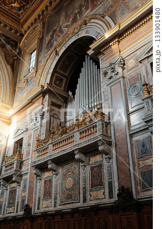 Archbasilica of Saint John Lateran interior Rome golden coffered ceiling marble columns statues ornate chapels baptistery and apse Catholic basilica Italy. High quality photo 133901480