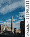 Lateran Obelisk in Piazza San Giovanni in Laterano Rome under blue sky ancient Egyptian granite monument with Latin base inscriptions city square landmark travel Italy. High quality photo 133901511