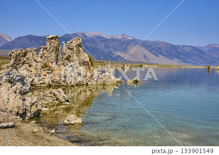 Mono Lake Tufa Towers and Sierra Nevada Mountains Reflected in Clear Blue Water 133901549