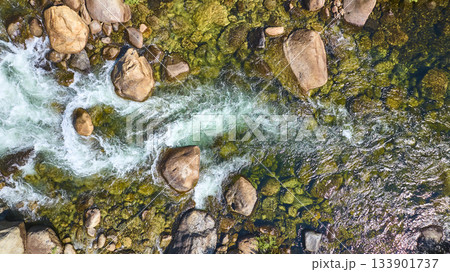 Aerial Merced River Flowing Over Rocks and Mossy Riverbed Top Down Aerial Merced River Flowing Over Rocks and Mossy Riverbed Top Down 133901737