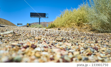 Ground Level Mojave Desert Roadside Gravel Shrubbery and Billboard California Ground Level Mojave Desert Roadside Gravel Shrubbery and Billboard California 133901750