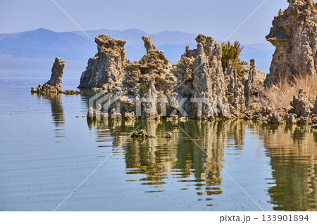 Tufa Formations Reflected in Tranquil Waters at Mono Lake California 133901894