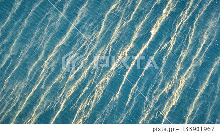 Aerial Sunlit Ripples and Water Texture Top Down 133901967