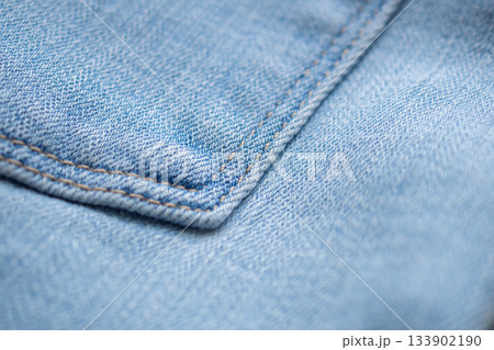 Old denim blue jeans fabric texture background close up Old denim blue jeans fabric texture background close up 133902190