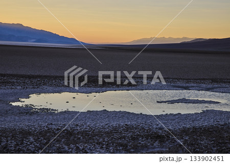 Saltwater Pool and Salt Flats at Golden Hour in Death Valley Desert Landscape Saltwater Pool and Salt Flats at Golden Hour in Death Valley Desert Landscape 133902451