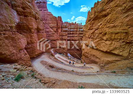 Bryce Canyon Wall Street Switchback Trail with Hikers and Towering Red Rock Formations 133903525