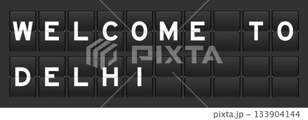 Black color analog flip board with word welcome to delhi on gray background 133904144