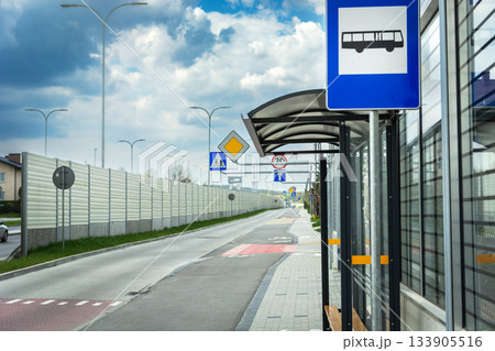Bus stop on the street with noise barriers Bus stop on the street with noise barriers 133905516