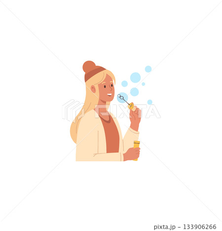 A blonde woman joyfully blows soap bubbles with a wand creating whimsical floating spheres in the A blonde woman joyfully blows soap bubbles with a wand creating whimsical floating spheres in the 133906266