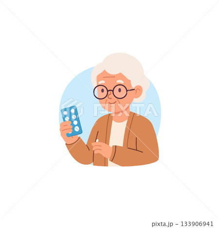 Elderly woman with spectacles holds blister pack and preparing medication in a bright health care 133906941