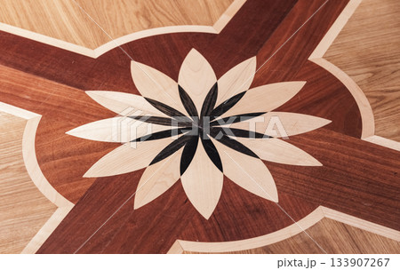 Flower design element of wooden parquet with different wood types 133907267