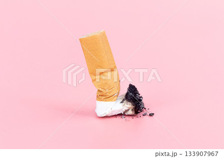 cigarette butts  on pink background 133907967