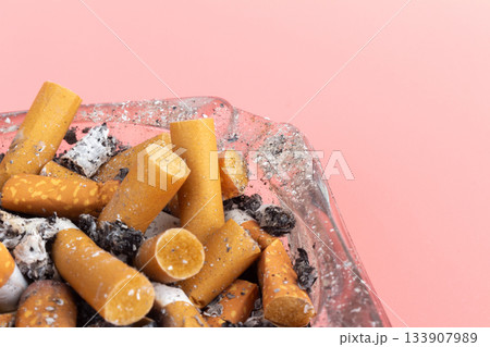 cigarette butts torn on pink background ashtray cigarette butts torn on pink background ashtray 133907989