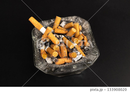 cigarette butts torn on black background ashtray 133908020