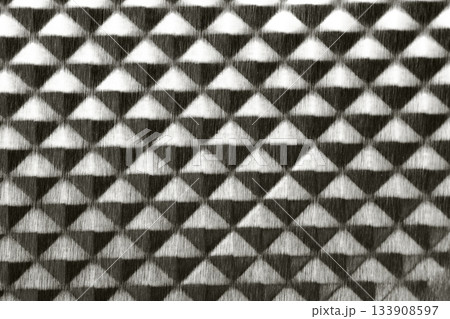 Tripartite brushed steel dark grey metal texture. pyramid geometric shape background color of 2026 year cloud white 133908597