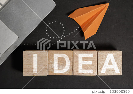 Generating New Ideas Laptop, Blocks, and Paper Airplane Concept. Business and Education concept, office equipment. High quality photo 133908599