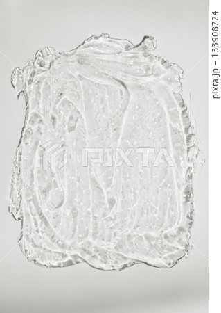 Dynamic clear gel swatch splash with air bubbles. Hydrating face cream. Beauty cosmetic product sample close up color of 2026 year cloud white Dynamic clear gel swatch splash with air bubbles. Hydrating face cream. Beauty cosmetic product sample close up color of 2026 year cloud white 133908724