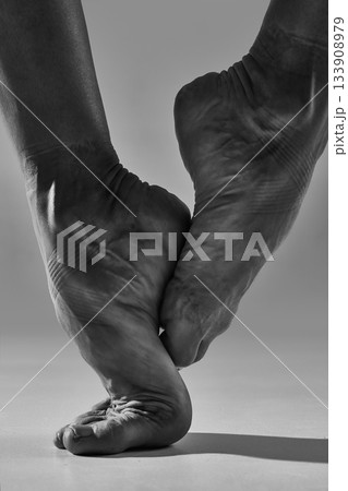Ballet feet close-up in soft monochrome tension 133908979