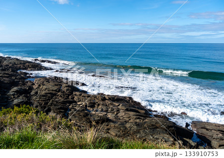 Rocky coastline along the Great Ocean Road in Australia with waves 133910753