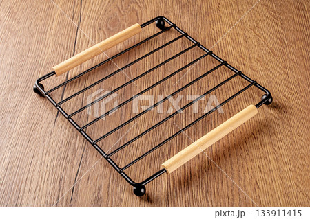 Elegant black grid stand perfect for displaying buns or muffins in style 133911415