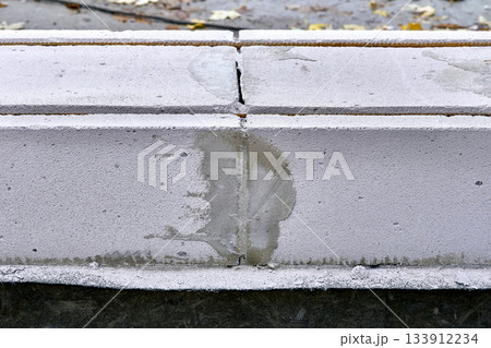 Construction joint between two concrete blocks, sealed with cement Construction joint between two concrete blocks, sealed with cement 133912234