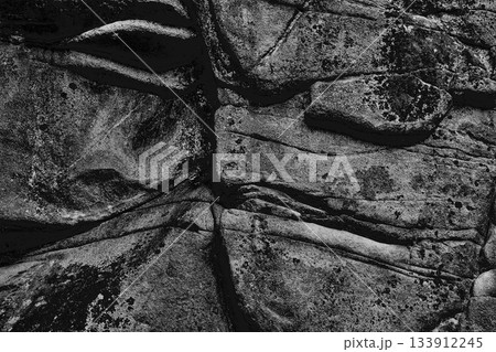 Dark rock stone formation.Cliff granite backdrop 133912245