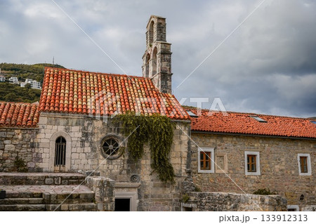 Photo of Santa Maria in Punta, one of the oldest buildings in Budva, Montenegro, located in the historic Old Town. Highlights medieval architecture, stone walls, and the charm of the coastal 133912313