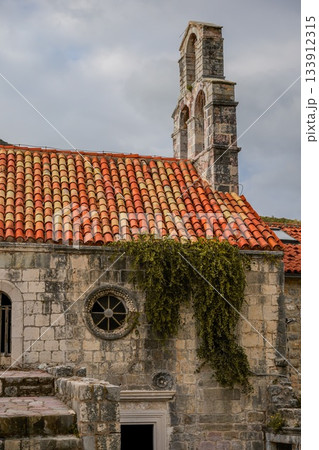 Photo of Santa Maria in Punta, one of the oldest buildings in Budva, Montenegro, located in the historic Old Town. Highlights medieval architecture, stone walls, and the charm of the coastal 133912315