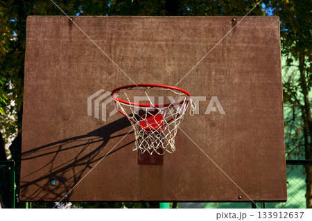 Street game.Basketball backboard with hoop basket on school playground 133912637