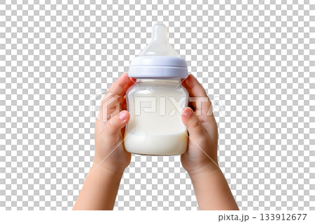 Baby's hands grasping baby bottle full of milk, isolated on transparent background for parenting and infant care designs 133912677
