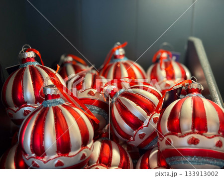 Striped red and white Christmas ornaments. Festive elegance, winter celebration and classic holiday style. 133913002