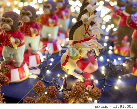 Circus style Christmas holiday figurines with horse and monkeys. Festive nostalgia, childhood memories and playful seasonal decoration. 133913003