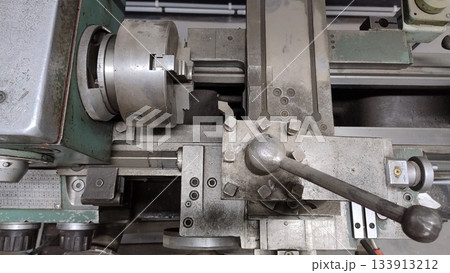 Old vintage rusty turning lathe. 133913212
