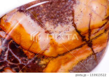 Macro mineral stone jasper "bird's eye" on white background 133913522
