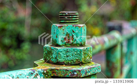 Rusted Bolt and Nut on Weathered Metal Railing 133913906