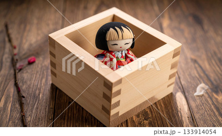 Kokeshi Doll in Wooden Box on Table Kokeshi Doll in Wooden Box on Table 133914054