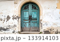 Old Weathered Blue Door in Stone Wall 133914103