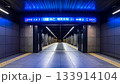 Modern Subway Station Platform with Blue Signage 133914104