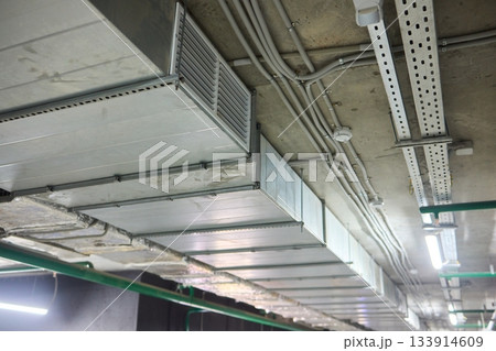 Subterranean parking details, Basement parking area equipped with lighting and plumbing, Underground vehicle shelter featuring electrical wiring and ventilation systems Subterranean parking details, Basement parking area equipped with lighting and plumbing, Underground vehicle shelter featuring electrical wiring and ventilation systems 133914609