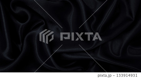 Smooth elegant black silk or satin luxury cloth texture as abstract background. Luxurious background design Smooth elegant black silk or satin luxury cloth texture as abstract background. Luxurious background design 133914931
