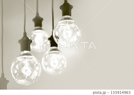 Vintage light bulbs illuminating a bright creative idea. Color of 2026 year dancer in the white cloud 133914963
