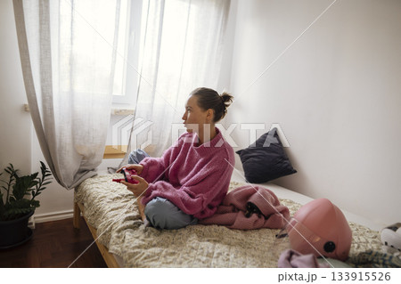 Peaceful morning reflection, Woman relaxing in gentle sunlight 133915526
