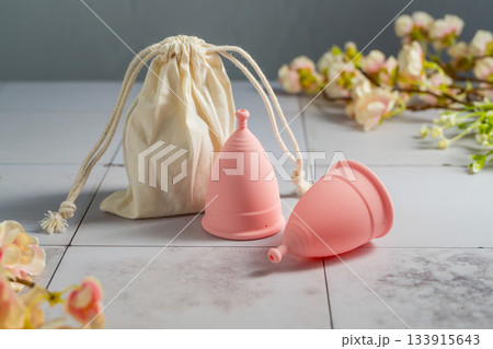 Menstrual cups. Pink feminine hygiene product. Women health concept. Menstrual cups. Pink feminine hygiene product. Women health concept. 133915643