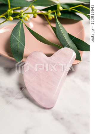 Rose quartz gua sha, abstract beauty photo 133915645