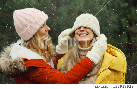 Happy smiling women friends having fun, celebration, joyful girlfriends together on Christmas tree 133915928