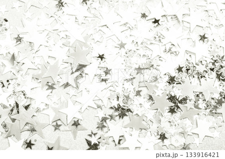 Shiny silver star confetti creating festive background texture. Color of 2026 year dancer in the white cloud 133916421