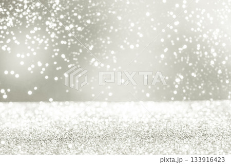 Silver sparkling bokeh light falling on glitter surface. Color of 2026 year dancer in the white cloud 133916423