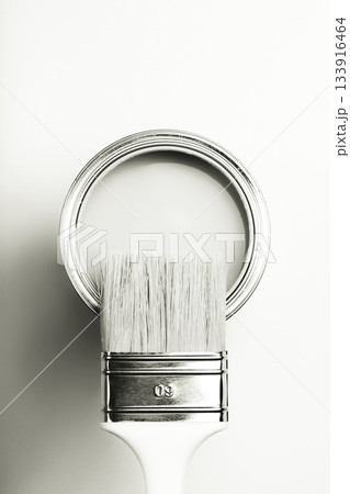 Paintbrush resting on an open paint can. Color of 2026 year dancer in the white cloud Paintbrush resting on an open paint can. Color of 2026 year dancer in the white cloud 133916464