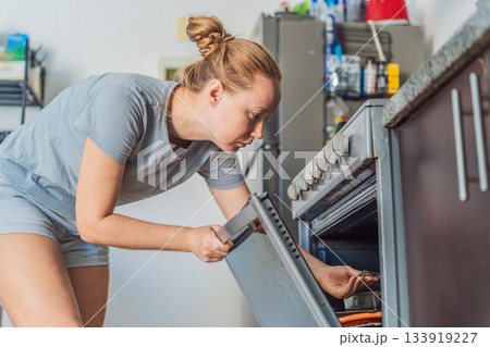 Woman preparing breakfast in a bright home kitchen, enjoying a calm morning routine and creating a warm start to the day. Healthy lifestyle, home cooking and cozy domestic living concept showing Woman preparing breakfast in a bright home kitchen, enjoying a calm morning routine and creating a warm start to the day. Healthy lifestyle, home cooking and cozy domestic living concept showing 133919227